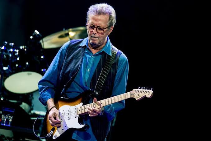 Eric Clapton performing on tour